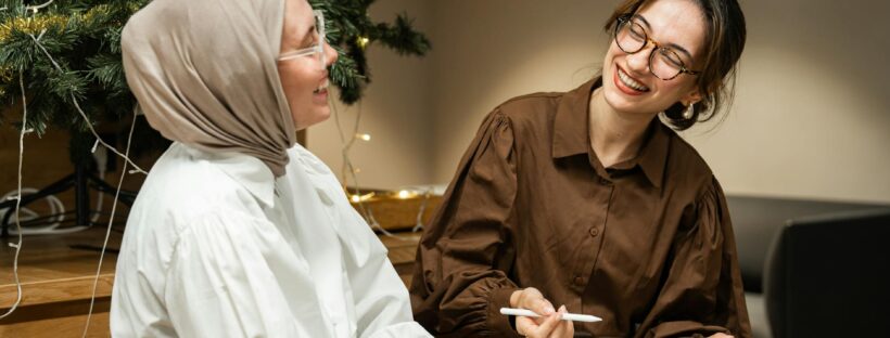 women sitting and smiling