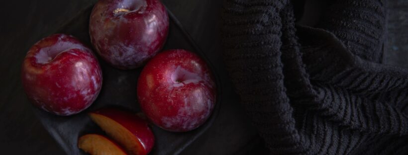 plums on a tray